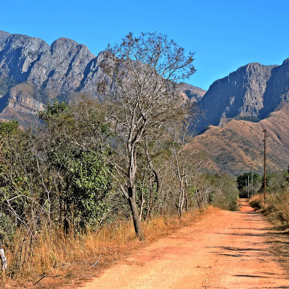 Mountain cliffs in Marakele National Park, in the Waterberg, above a dirt road